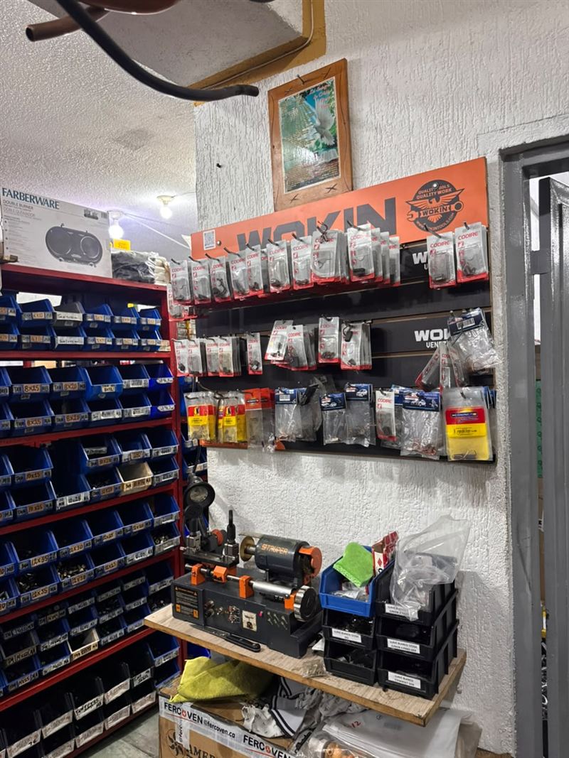 Shelves of labeled screw bins inside Ferrearca